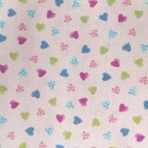 Tela de peines y cepillos sobre rosa de 1,50