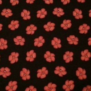 Tela con florecitas rojas sobre negro de quilting treasures