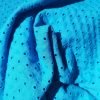 Batista perforada con agujeros y bodoques en azul turquesa