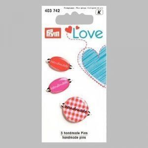 Handmade pins en tonos rosas y rojos de prym